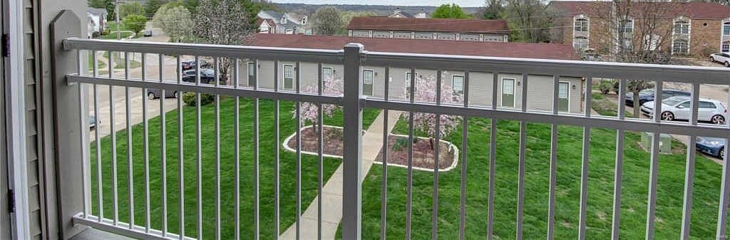 View from the covered deck over the lawn and courtyard